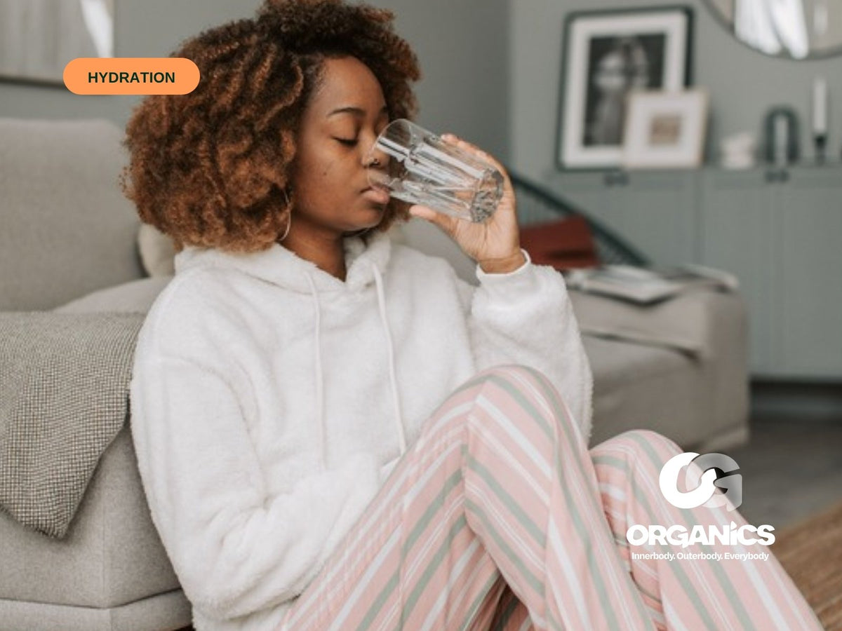 Woman drinking a glass of water at home