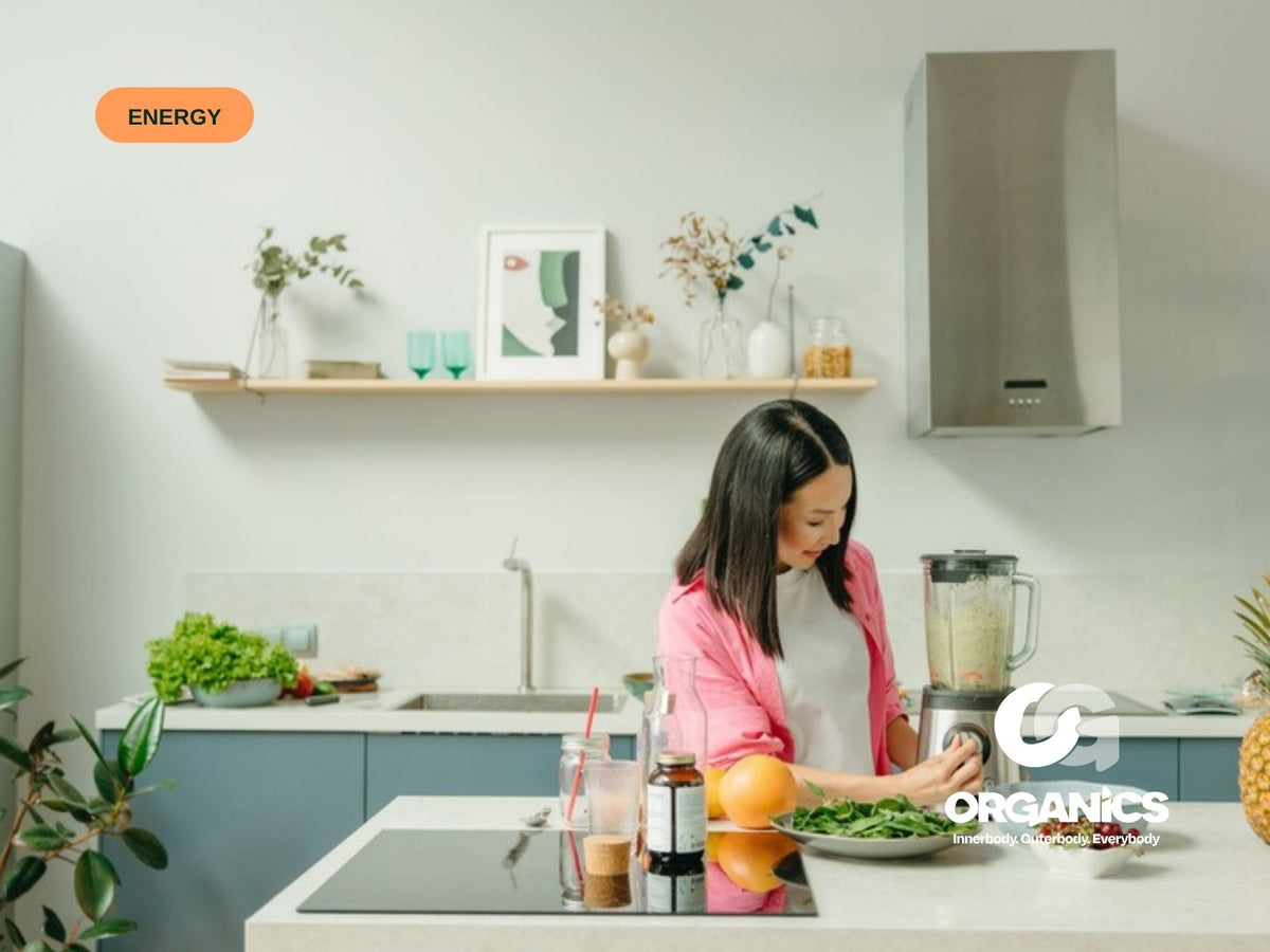 Woman making a green smoothie in her kitchen