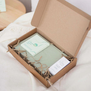 Open Sleep Gift Box with notebook, affirmation cards and sleep spray packaged in kraft box, part of natural sleep remedies collection.

